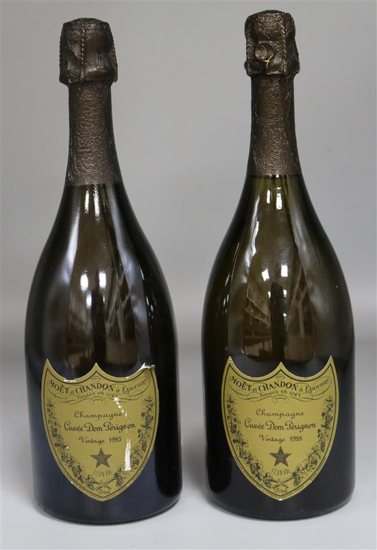Two bottles of Dom Perignon Vintage Champagne, 1985 and 1988.